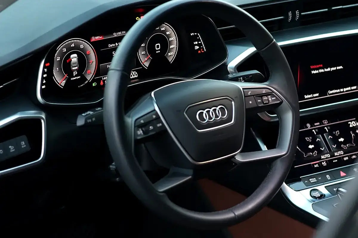 Side profile of an Audi A6 parked in Dubai, illustrating its smooth lines and executive presence for luxury car rentals.