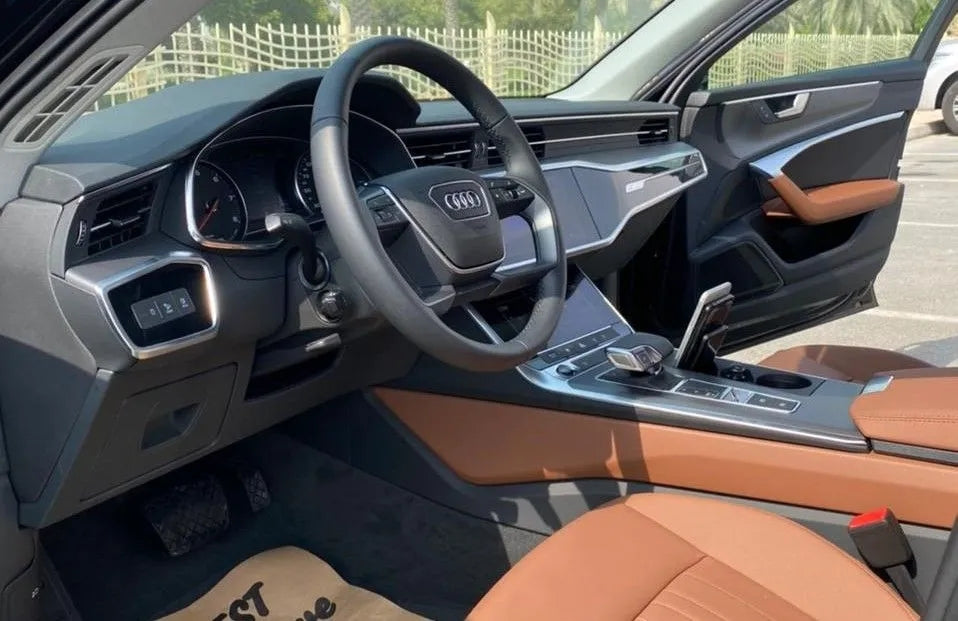 Audi A6 luxury car rental in Dubai, highlighting its dynamic lines and executive appeal.