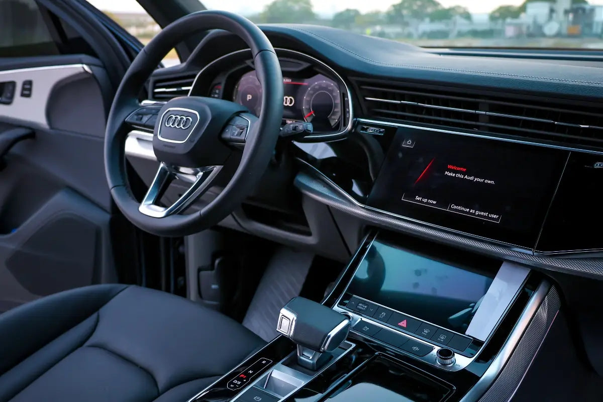 Audi Q7 cruising on Dubai roads, representing the ultimate in luxury SUV rental experiences.