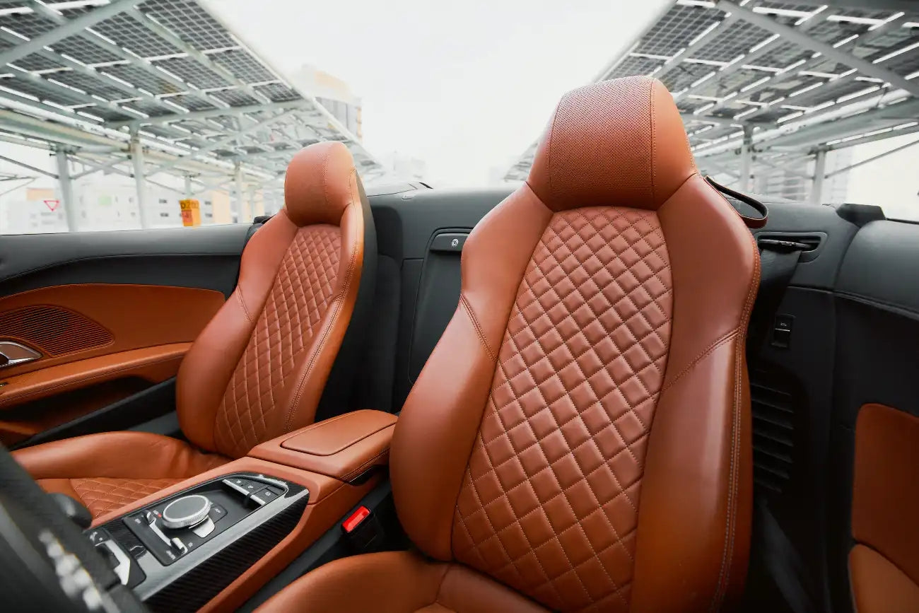 Rear view of Audi R8 Spyder, showcasing sporty design and exhaust, available in Dubai rental.