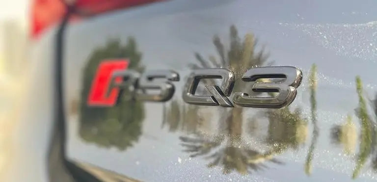 Rear view of the Audi RS Q3, emphasizing its sporty design and luxury rental appeal in the heart of Dubai.