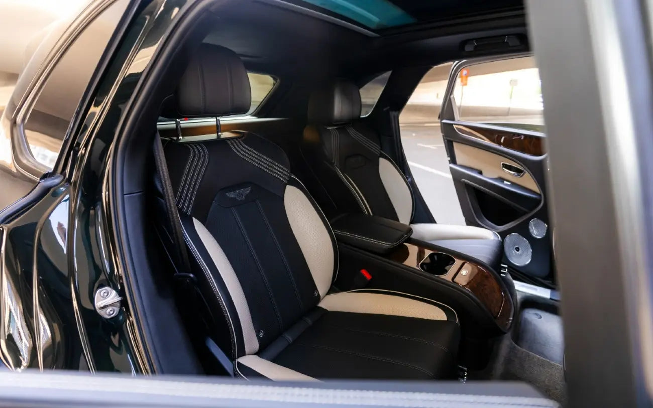 Bentley Bentayga S's dashboard and steering wheel, epitome of luxury for your Dubai journey.