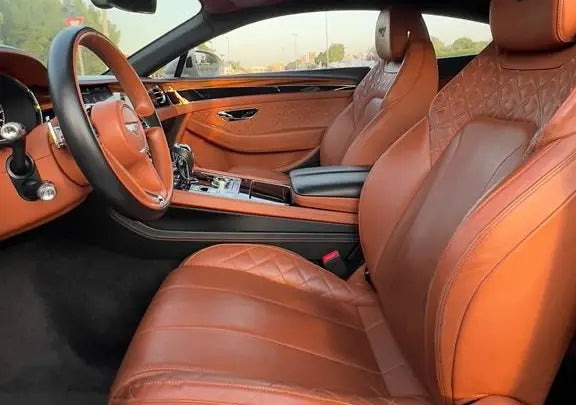 Imposing Bentley Bentayga under the Dubai skyline, perfect choice for high-end SUV enthusiasts looking to rent.