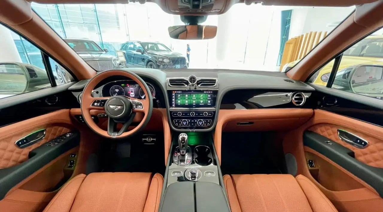 Close-up of the Bentley Bentayga's alloy wheels and badge, symbolizing luxury and exclusivity in Dubai rentals.