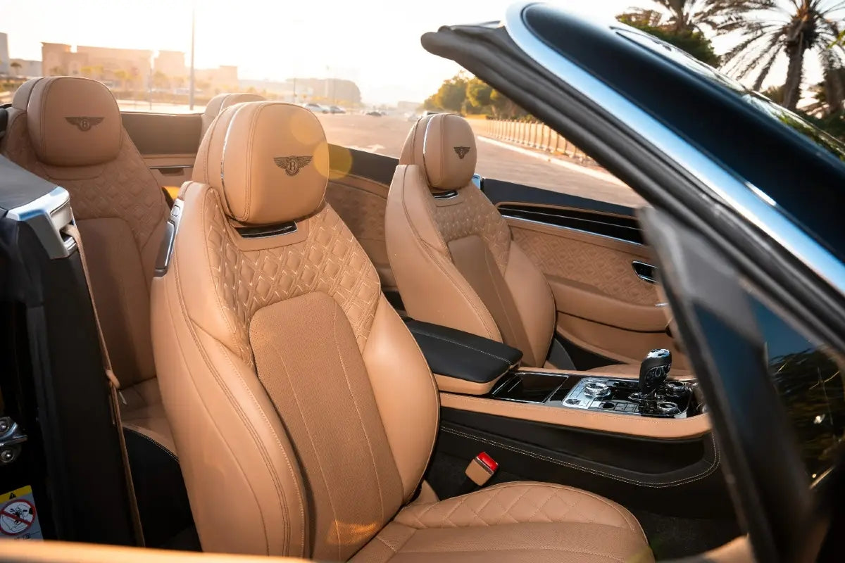 Rear angle of the Bentley Continental GTC Mulliner, highlighting the car's elegant lines and available for rent in Dubai.
