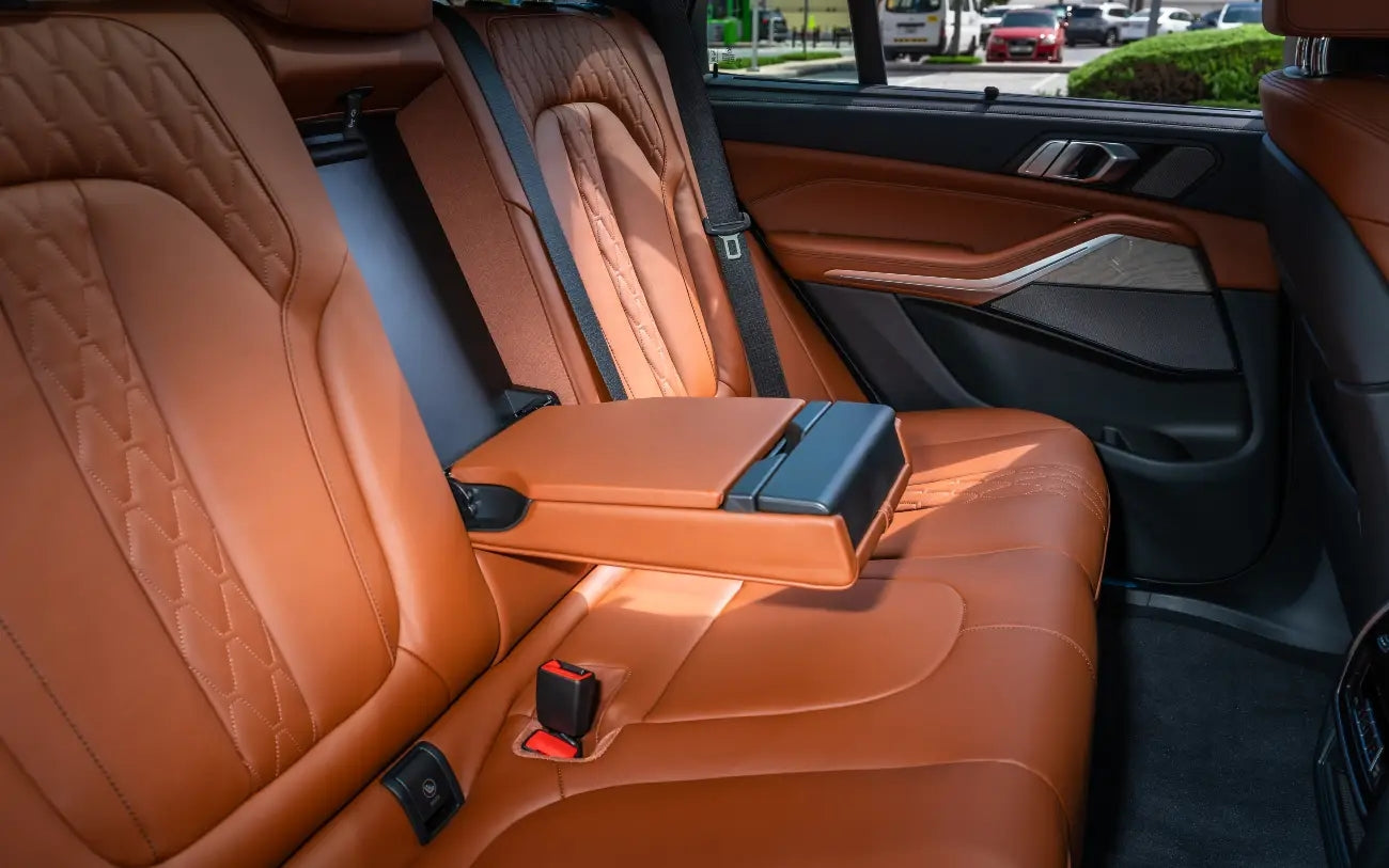 BMW X5's luxury leather seats and spacious interior, offering comfort and style for passengers on Dubai journeys.