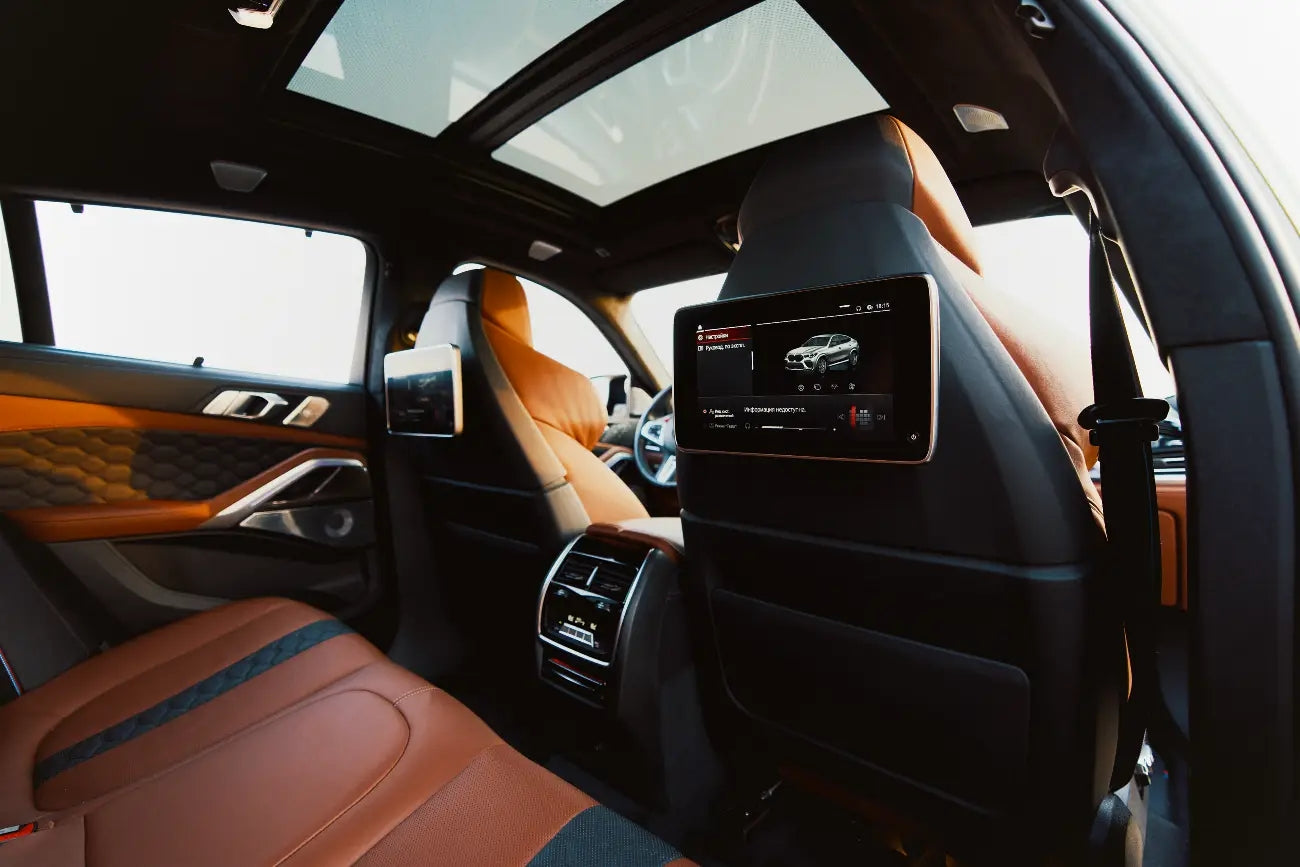 BMW X6 M Competition cruising on Dubai's roads, epitomizing luxury and performance in SUV rentals.