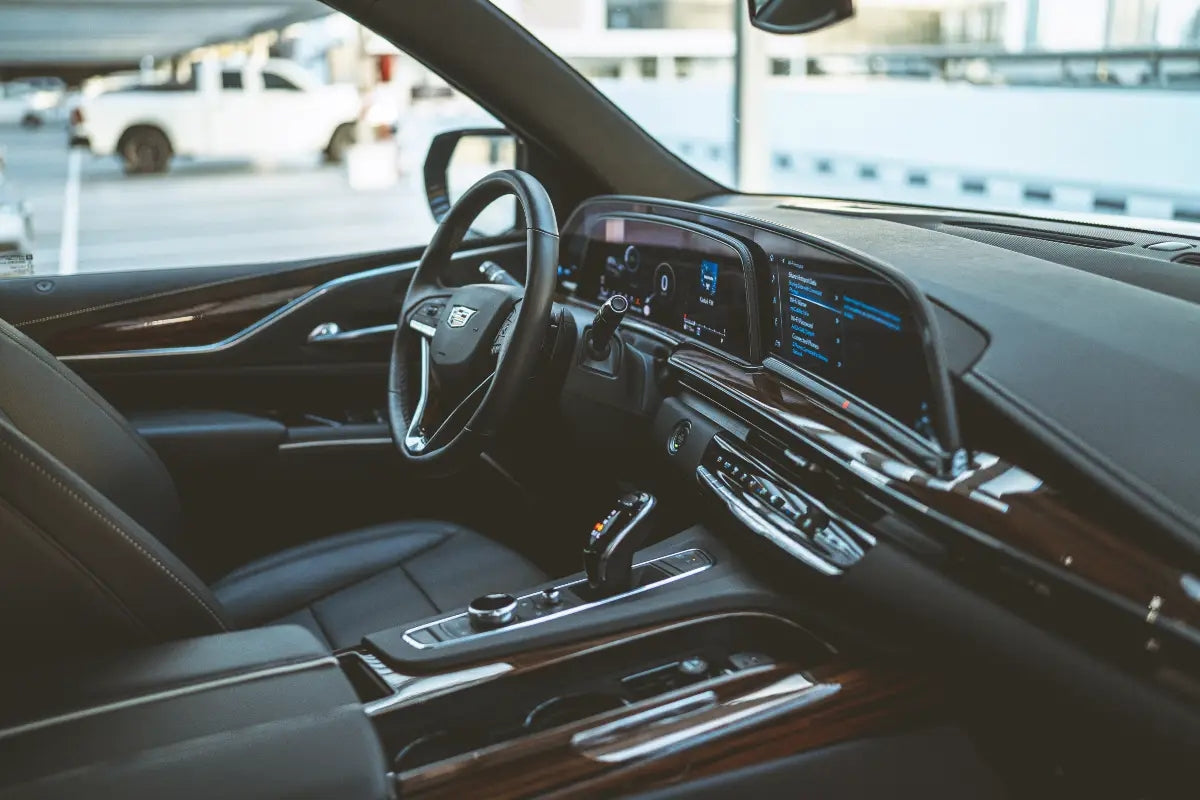 Rear view of the Cadillac Escalade 600 luxury SUV, emphasizing its sophisticated tail lights and ample cargo space, available in Dubai.