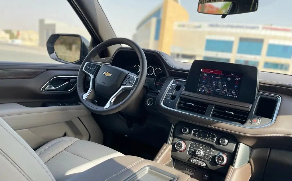Chevrolet Tahoe in a stunning sunset in Dubai, showcasing its luxury SUV silhouette for rent.