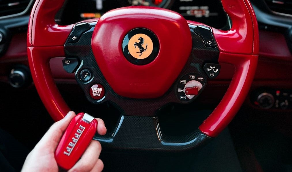 Elegant silhouette of the Ferrari 488 at sunset in Dubai, capturing the essence of luxury car rentals.