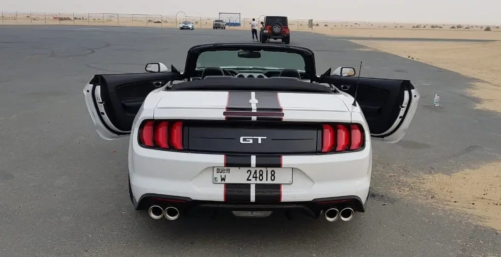 Experience Dubai in a Ford Mustang Convertible, the ultimate luxury sports car rental for thrill-seekers.