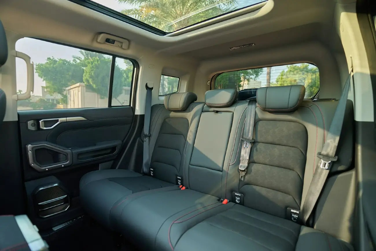 Jetour T2 cruising on a Dubai highway, perfect for premium rental service seekers.