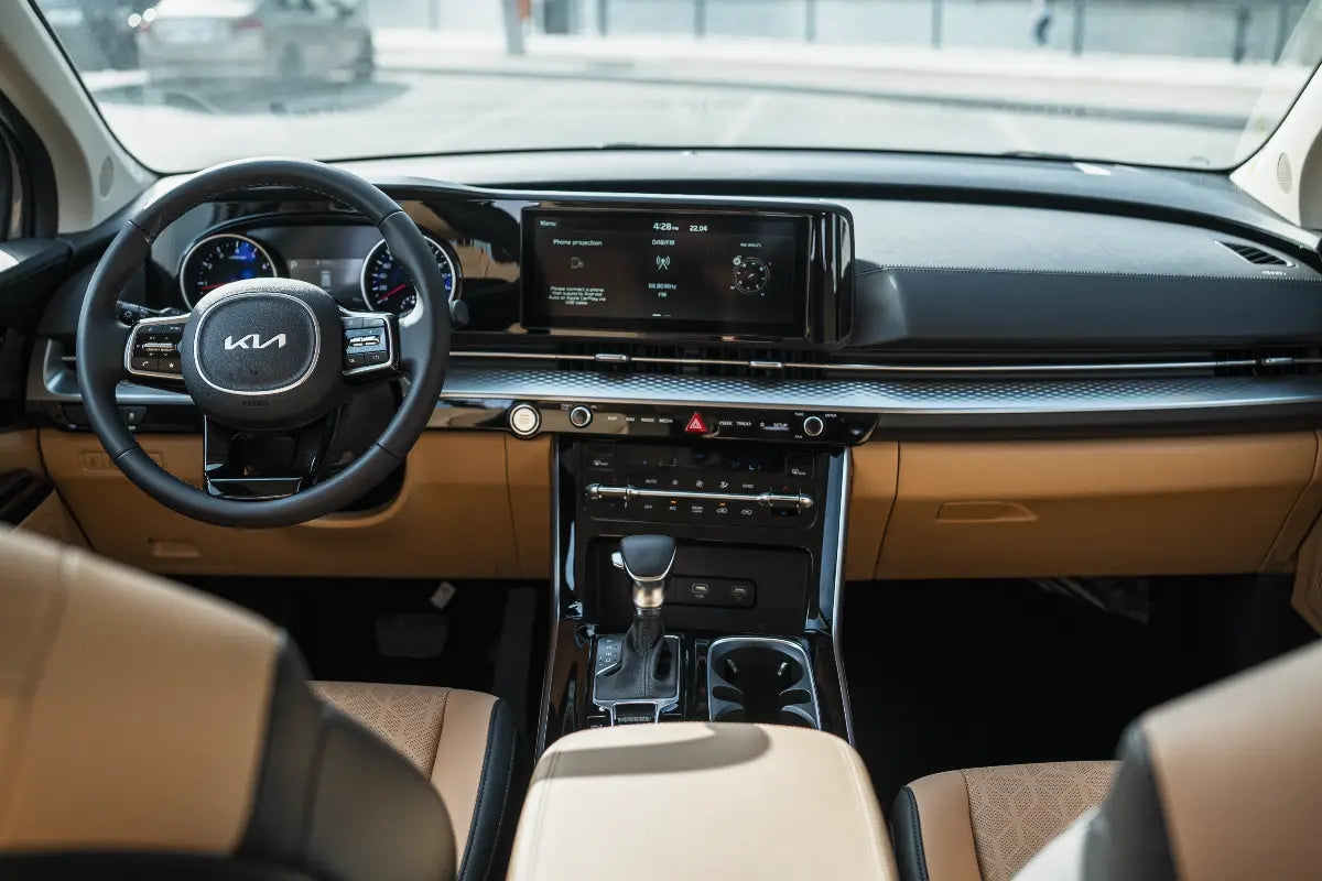 KIA Carnival luxury van at night in Dubai, highlighting its impressive lighting and appeal for stylish transportation rentals.