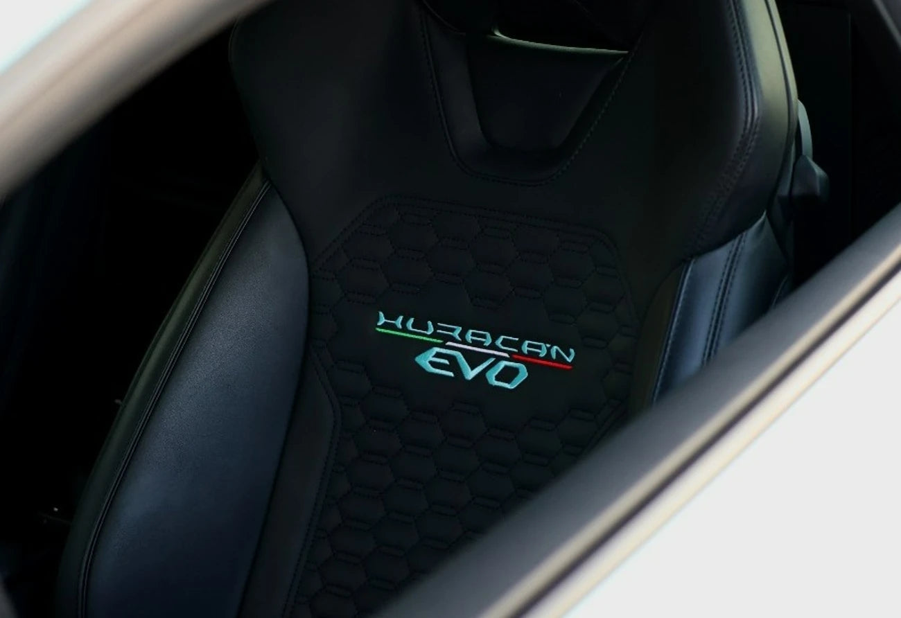Lamborghini Huracan EVO in motion, displaying power and elegance, a premier sports car rental choice in Dubai.
