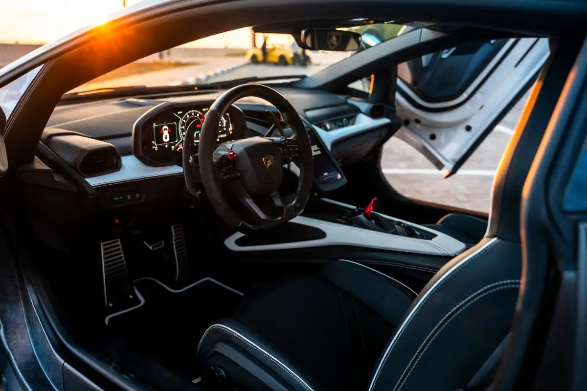 Interior shot of a Lamborghini Revuelto for hire in Dubai, featuring luxurious leather seats and advanced digital dashboard.