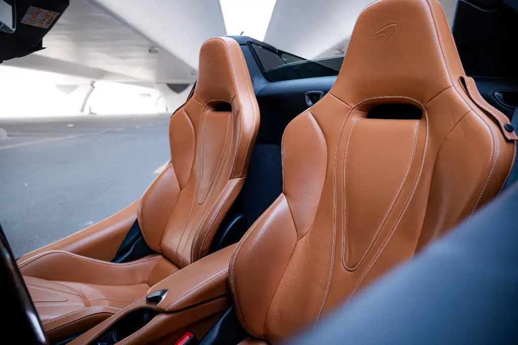 Close-up of the distinctive alloy wheels of a McLaren 720S Spider for rent in Dubai, epitomizing luxury.