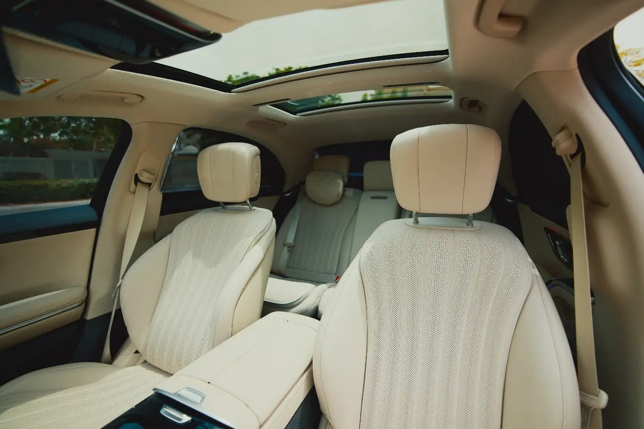 Close-up of the 2021 Mercedes-Benz S500 dashboard and steering wheel, illustrating the car's high-end technology - luxury car hire in Dubai