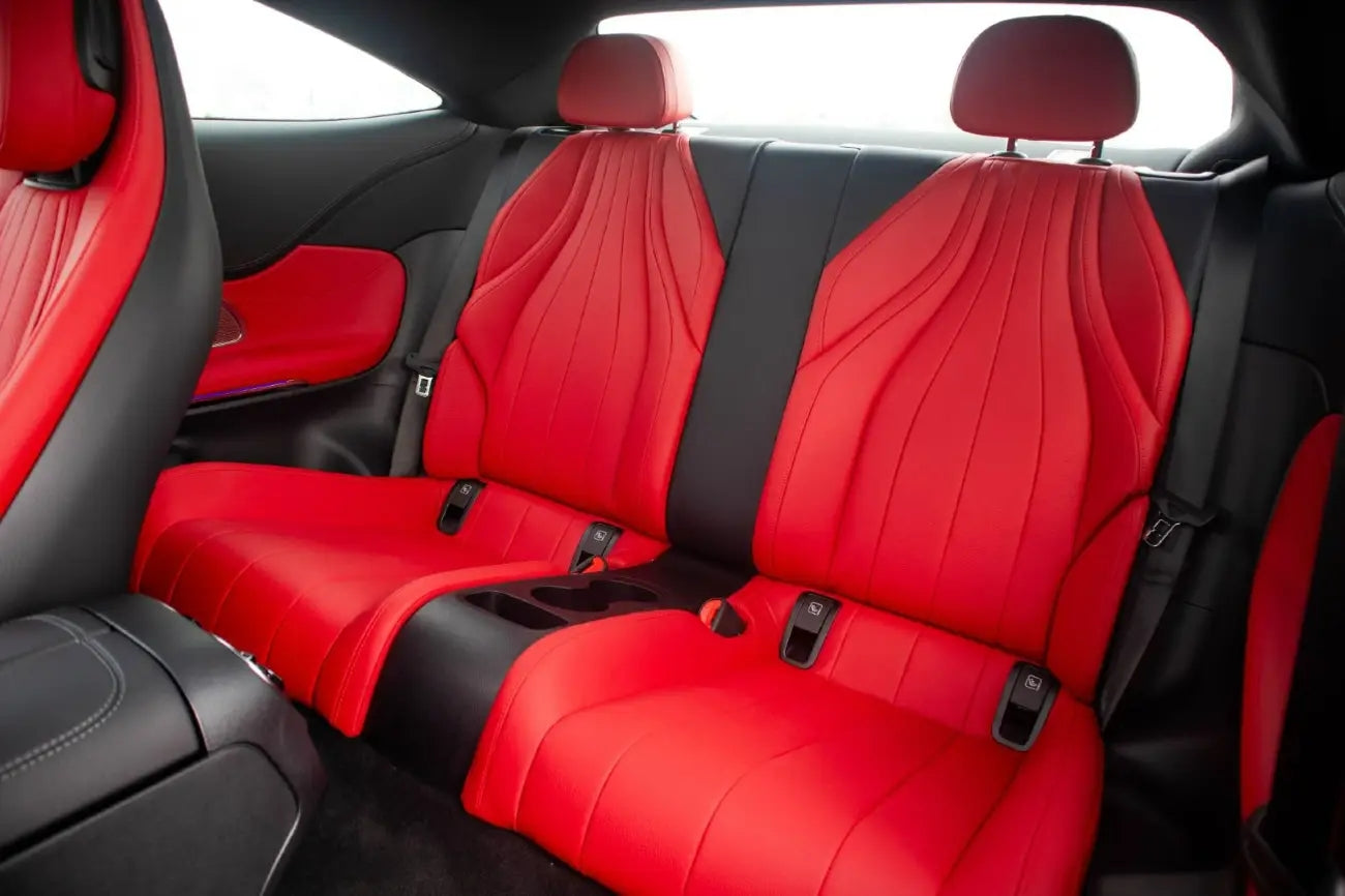 Mercedes CLE 200 luxury coupe under Dubai's night lights, exclusive rental experience.