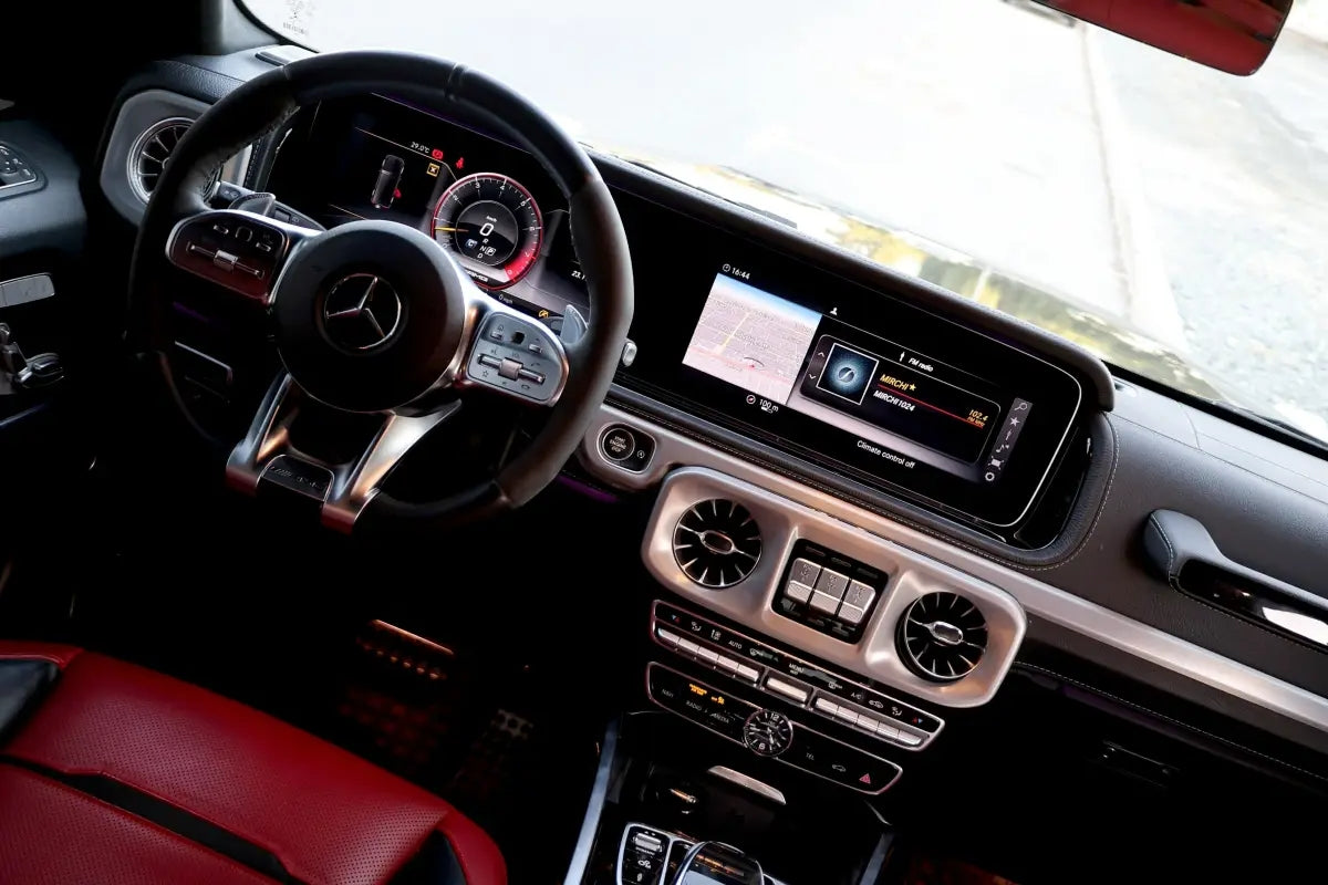 Close-up of the Mercedes G63's alloy wheels and badging, representing the pinnacle of luxury SUV rentals in Dubai.