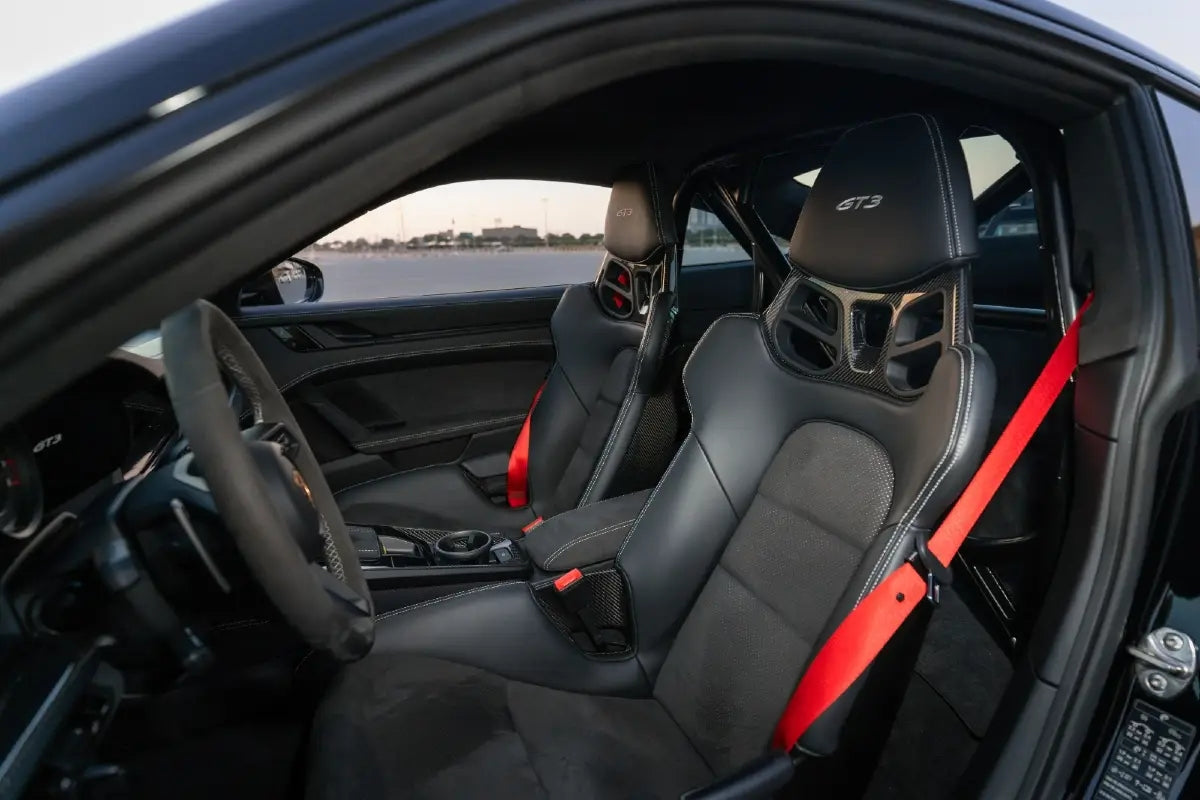 Night view of Porsche 911 GT3 with Fi Exhaust, illuminated in Dubai's city lights, perfect for an upscale driving experience.