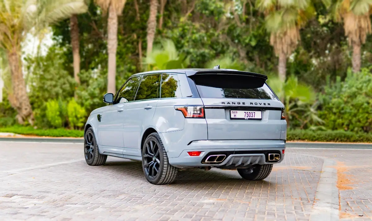 Dynamic side shot of a Range Rover SVR in motion, illustrating luxury and power - ideal for Dubai car rentals.