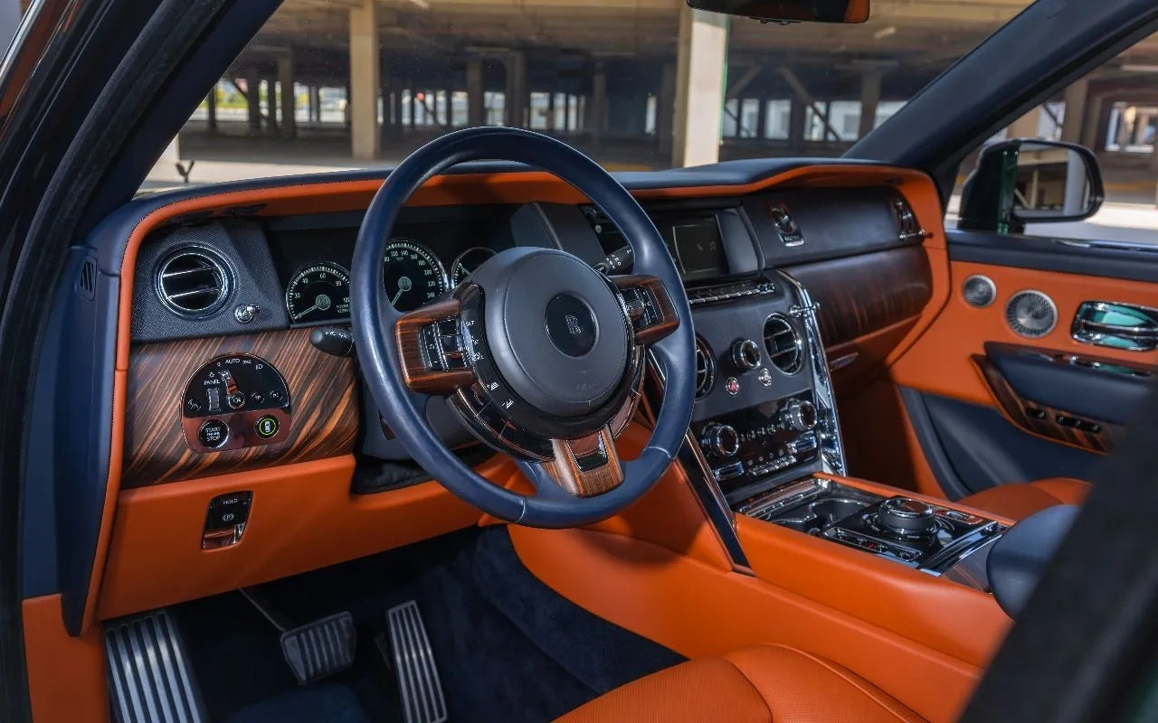 Close-up of Rolls Royce Cullinan's distinctive grille, symbolizing luxury SUV rentals in Dubai.