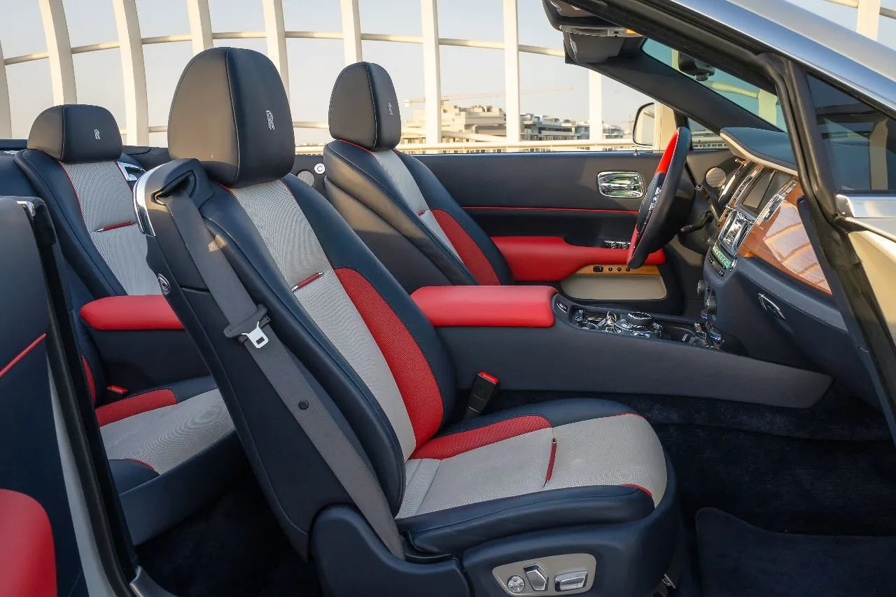 Rolls Royce Dawn parked with the Dubai skyline in the background, epitomizing luxury car rental experience in the UAE.