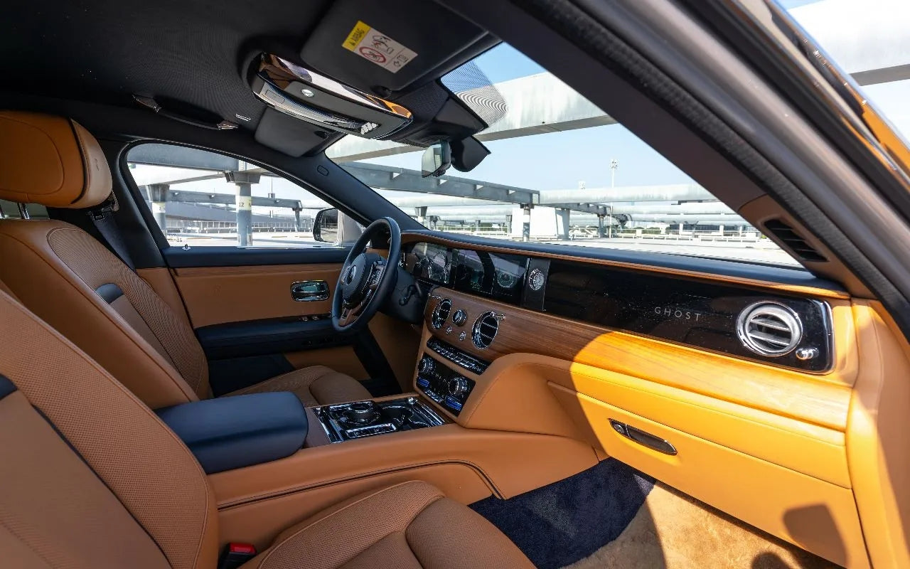 Rolls Royce Ghost in motion on Dubai's roads - epitome of luxury and comfort in car rentals.
