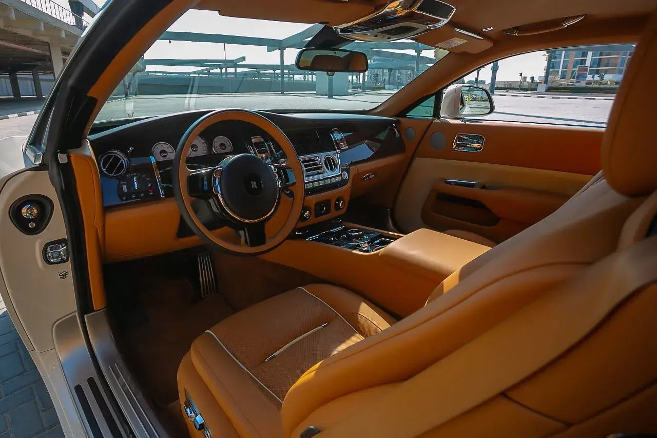 Rolls Royce Wraith's powerful performance captured on Dubai's roads, representing the pinnacle of luxury car rentals.