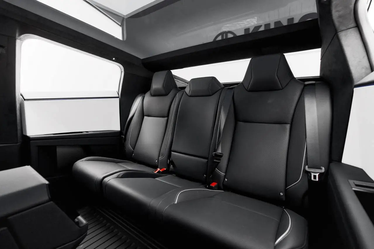 Close-up of Tesla Cybertruck's rugged wheels, ready for any terrain in Dubai luxury rental market.