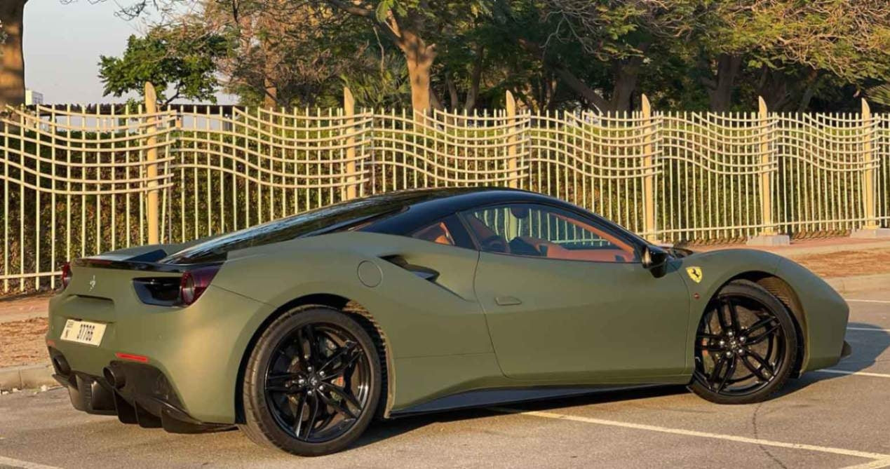Gleaming side view of a Ferrari 488, the ultimate choice for sporty car rentals in Dubai.
