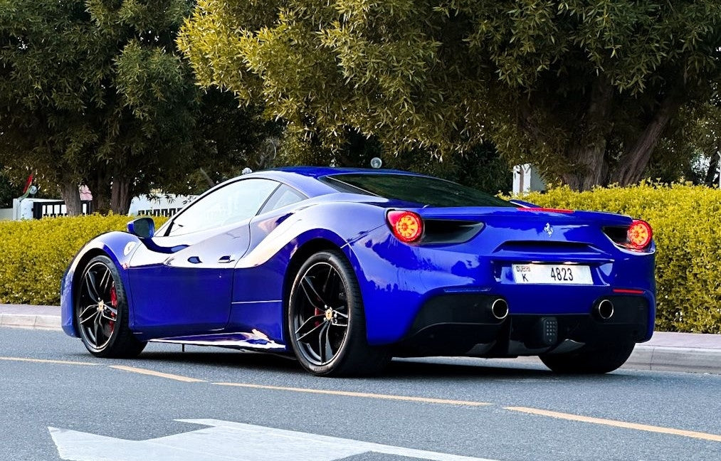 Interior shot of a Ferrari 488, featuring high-end finishes, available for rent in Dubai's luxury car market.
