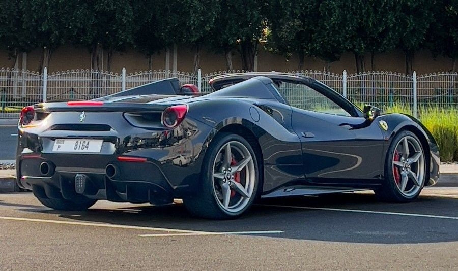 Elegant interior shot of a Ferrari 488 Spyder, emphasizing the luxury cockpit and advanced features for rent in Dubai.