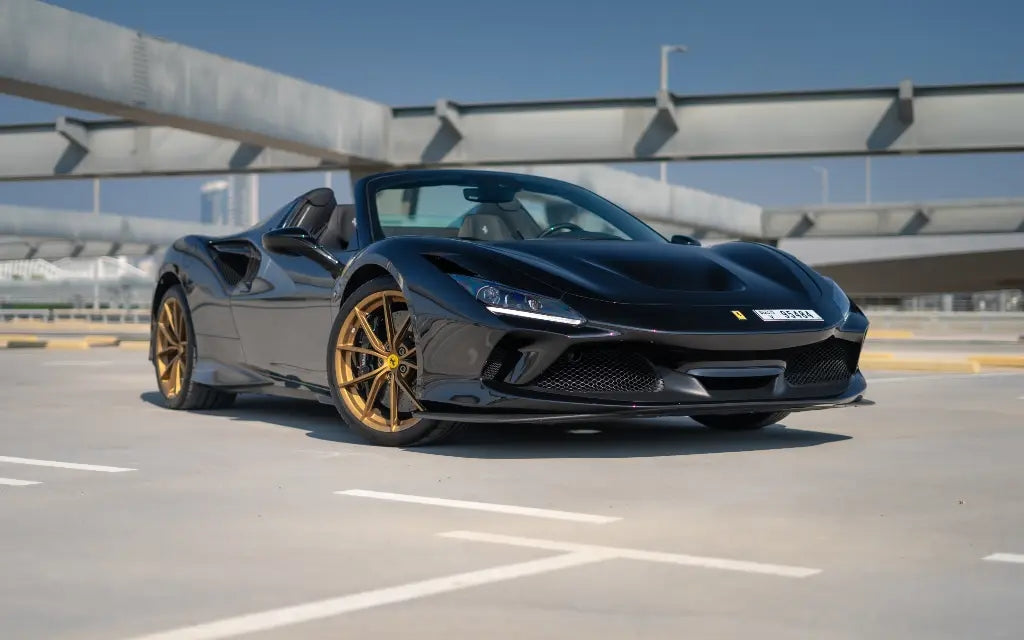 Red Ferrari F8 Tributo Spyder available for rent in Dubai, showcasing its sleek design and sporty silhouette.