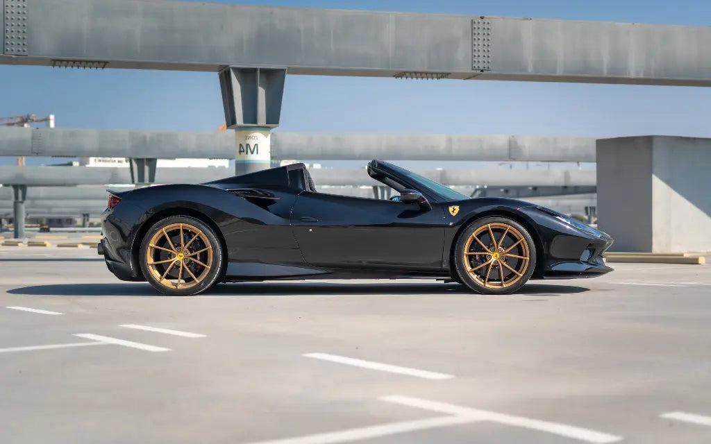 Interior view of a Ferrari F8 Tributo Spyder, highlighting the luxurious cockpit and state-of-the-art dashboard, available in Dubai.