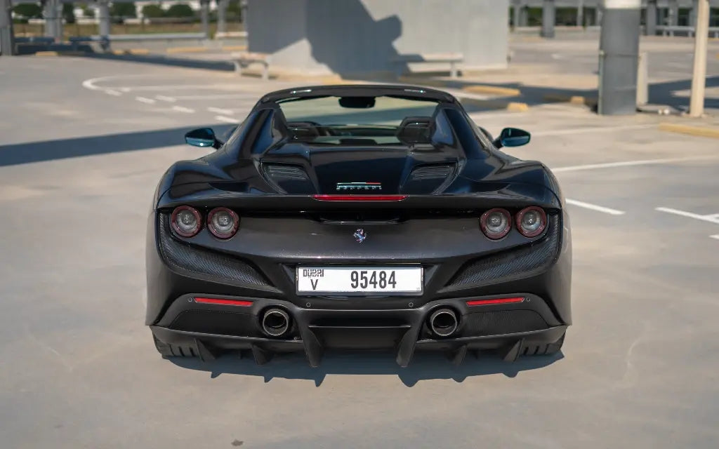 Ferrari F8 Tributo Spyder with its convertible roof down, ready for a scenic drive in Dubai, perfect for luxury car enthusiasts.