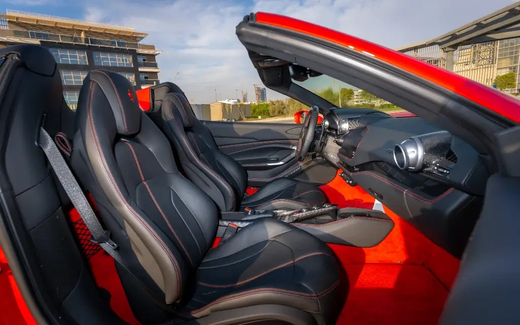 Ferrari F8 Tributo Spyder in action on a Dubai highway, epitomizing speed and luxury - Exotic car rental services.