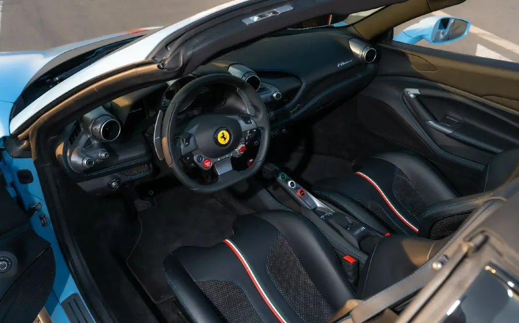 Ferrari F8 Tributo Spyder with the roof down, ready for a scenic drive - top choice for sports car rentals in Dubai.