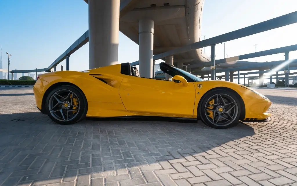 Experience the thrill of Dubai roads with the Ferrari F8 Tributo Spyder rental, a pinnacle of sports cars.