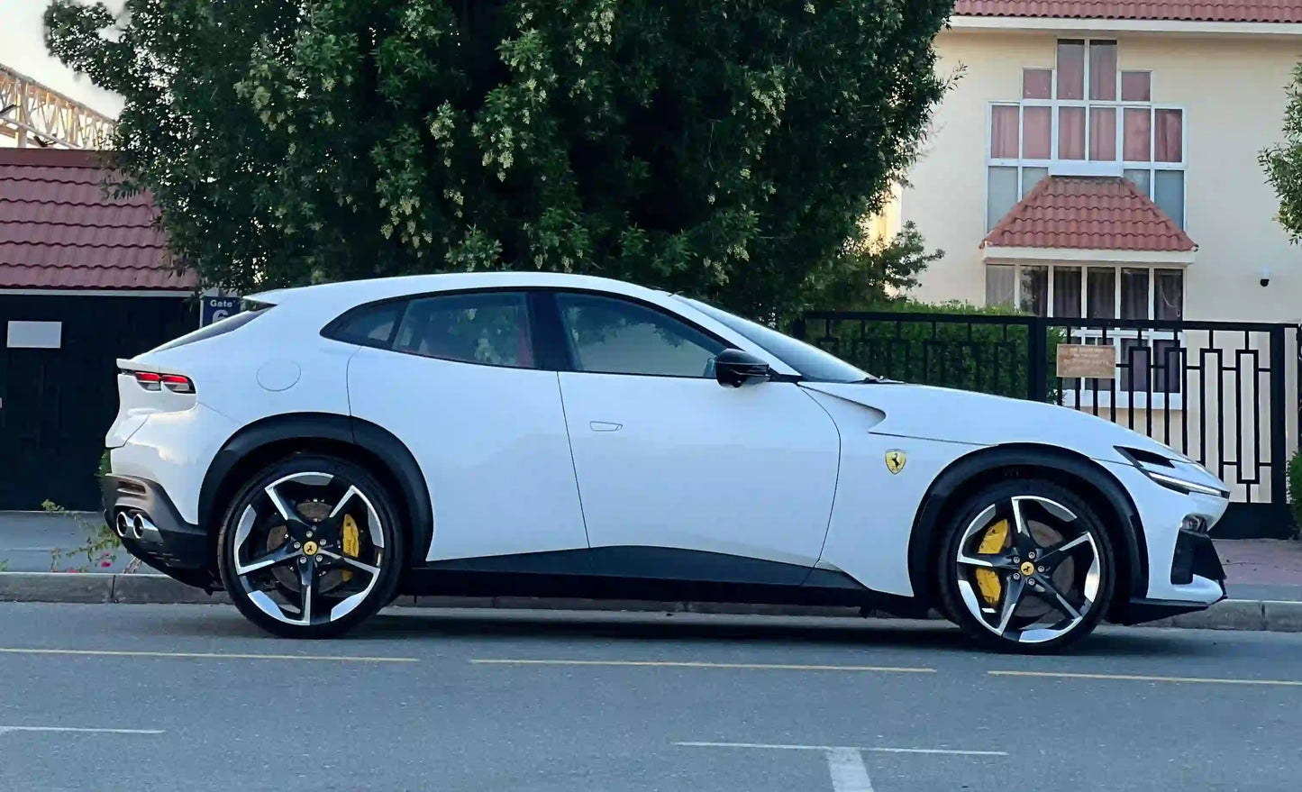 Front angle shot of sleek Ferrari Purosangue, the epitome of luxury SUVs for rent in Dubai.