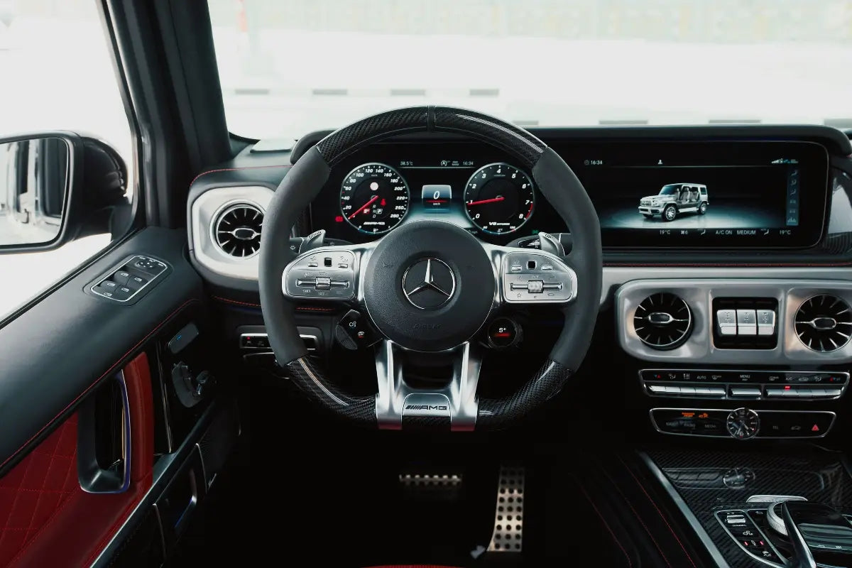 Mercedes-Benz AMG G63 cruising on Dubai streets, a top choice for luxury SUV rentals.