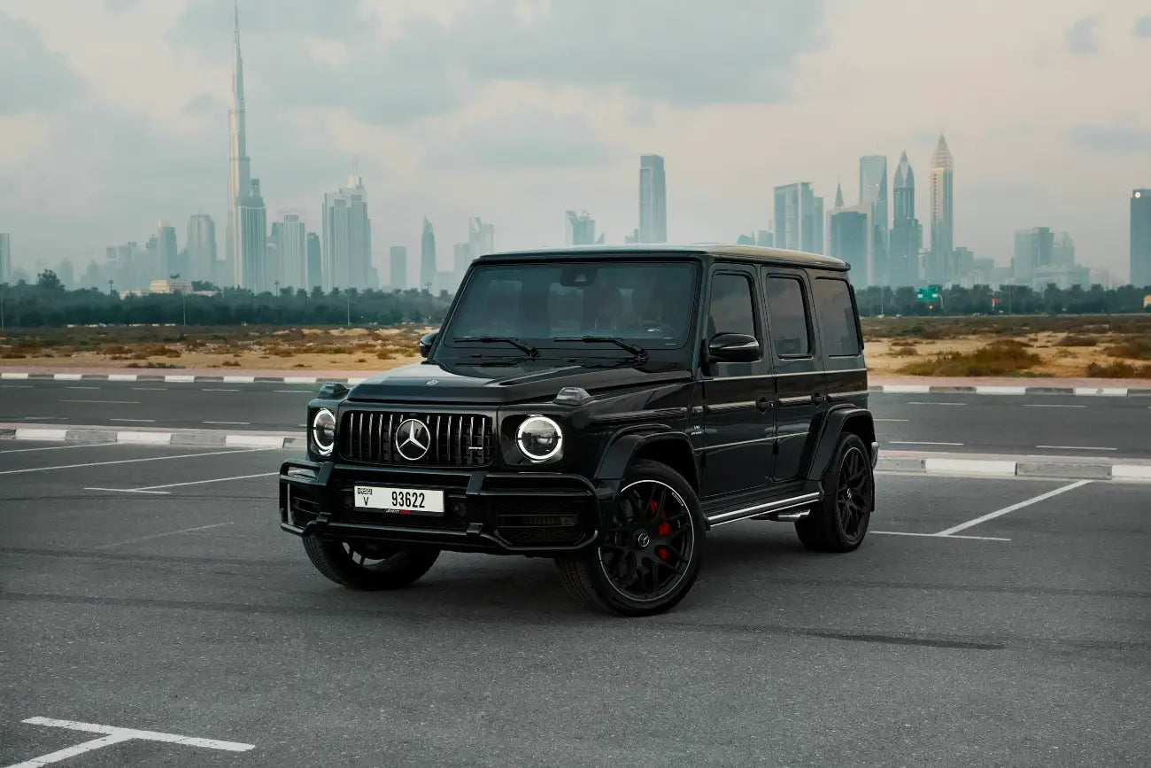 Luxury Mercedes Benz AMG G63 side view in Dubai, showcasing its sleek design and powerful stance for high-end rentals.