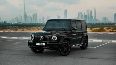 Luxury Mercedes Benz AMG G63 side view in Dubai, showcasing its sleek design and powerful stance for high-end rentals.