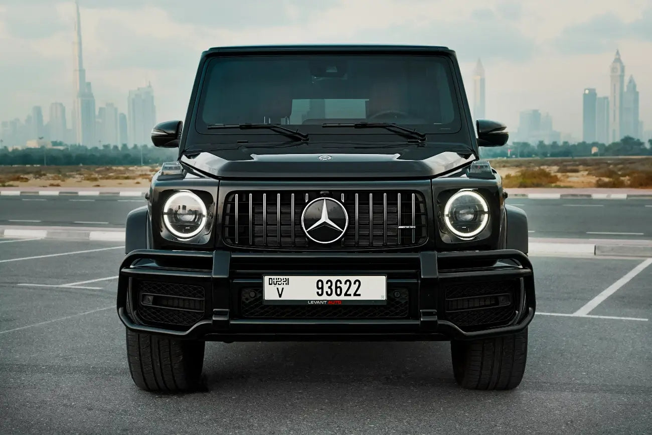Front angle of a gleaming Mercedes Benz AMG G63 in Dubai, a perfect choice for luxury SUV rentals with unmatched style.