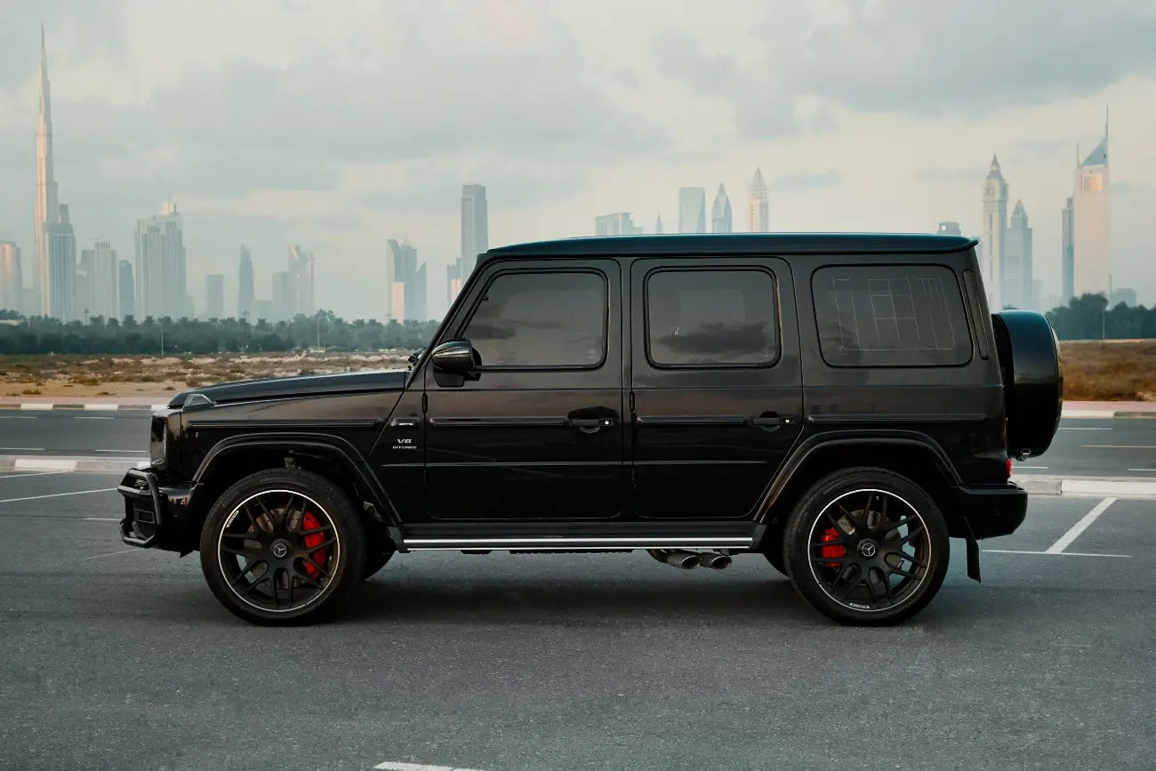 Elegant interior shot of the Mercedes Benz AMG G63, highlighting the sophisticated dashboard and luxurious seating for Dubai rentals.