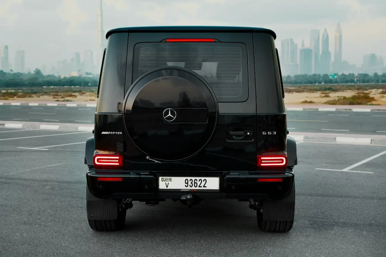 Rear view of the Mercedes Benz AMG G63, emphasizing the powerful exhaust and spacious cargo area, available for rent in Dubai.