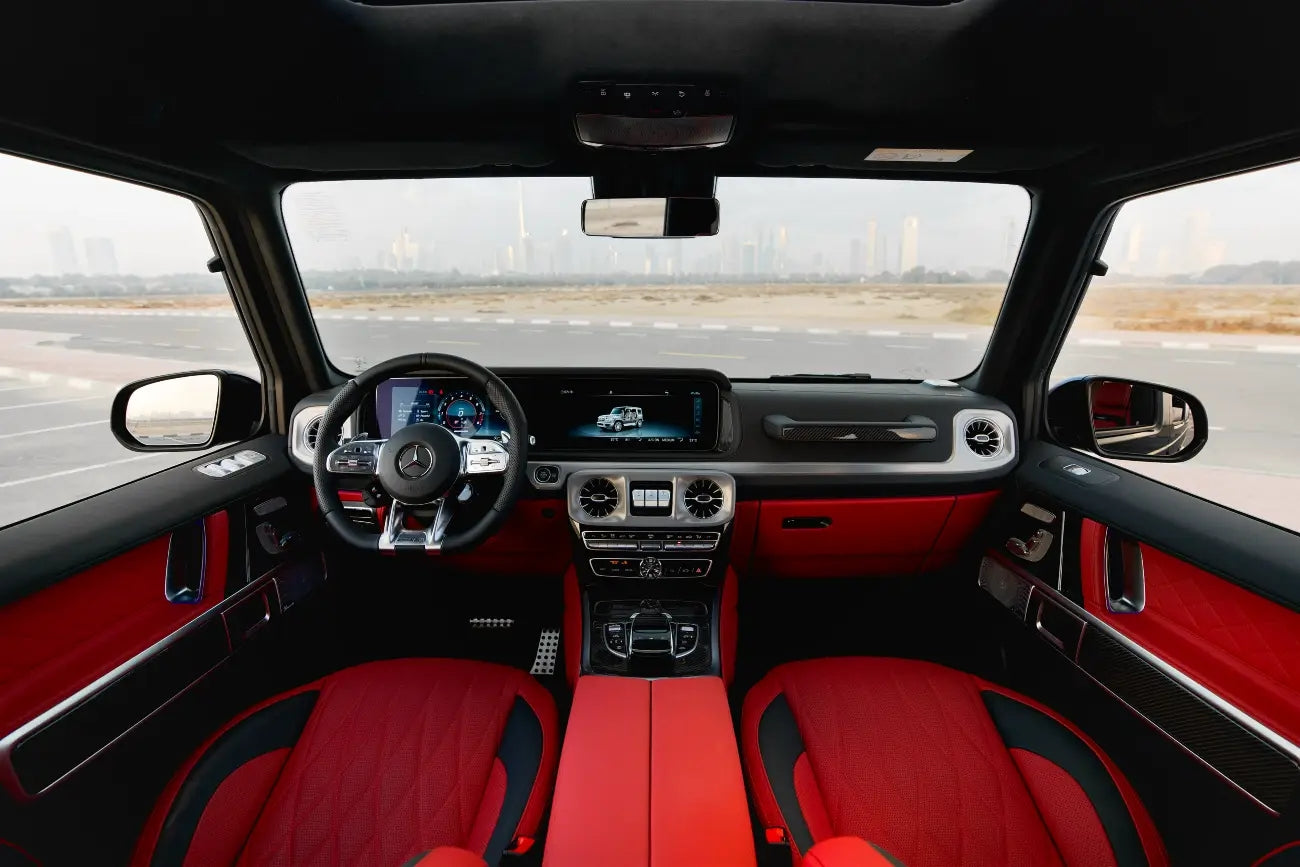Close-up of the Mercedes Benz AMG G63's distinctive grille and LED headlights, symbolizing luxury SUV rentals in Dubai.