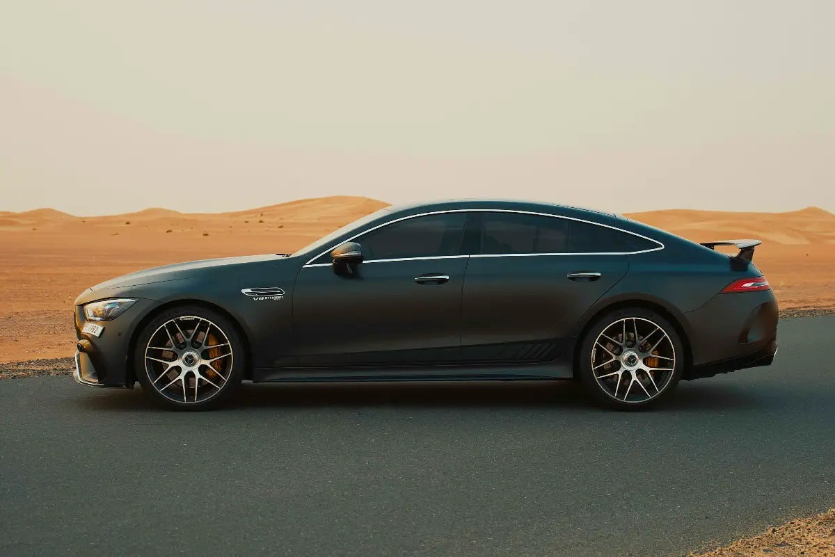 Front angle shot of the Mercedes Benz AMG GT 63s, emphasizing the distinctive grille and LED lights, perfect for Dubai rental.