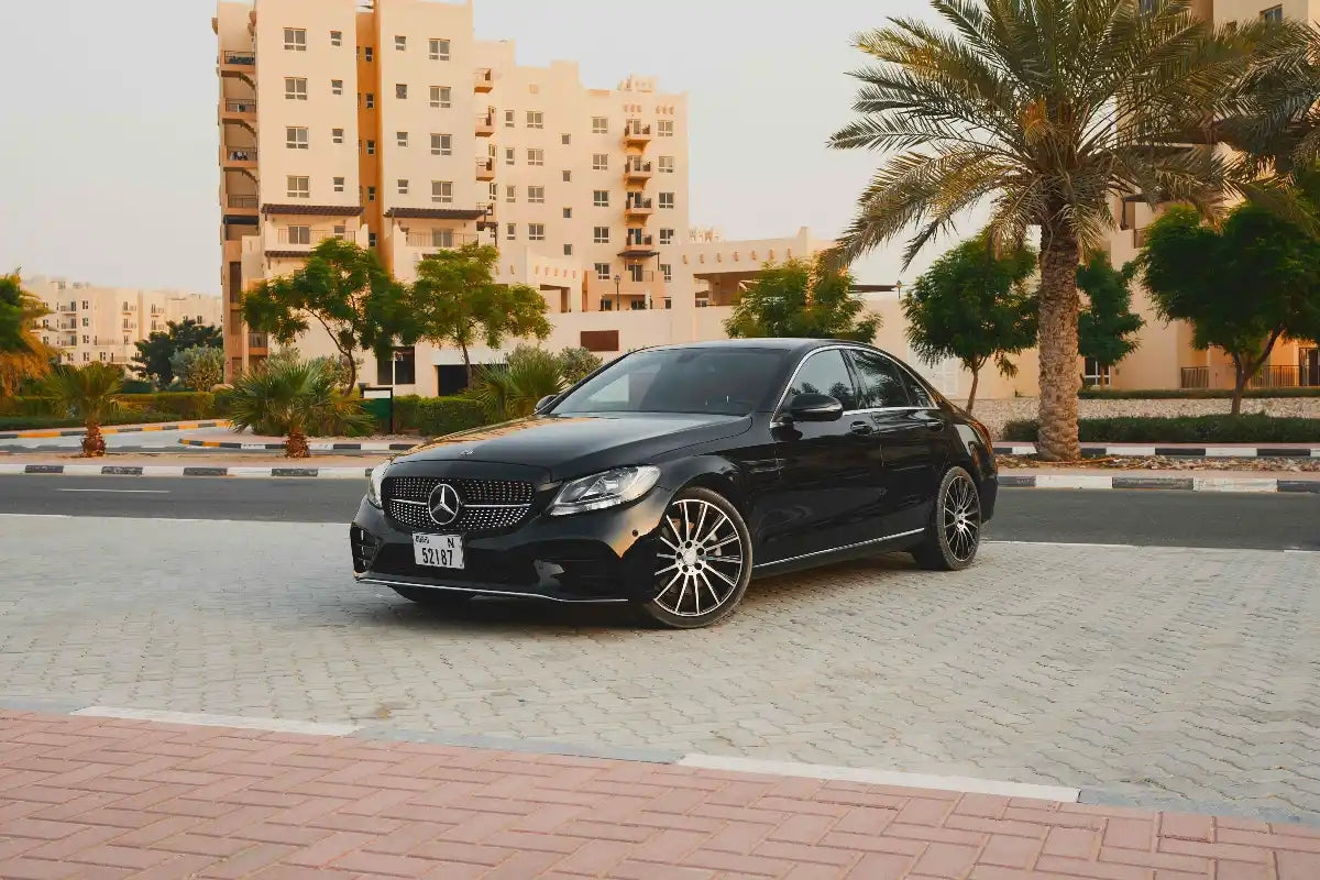 Luxury Mercedes Benz C300 executive sedan side view, available for rent in Dubai.