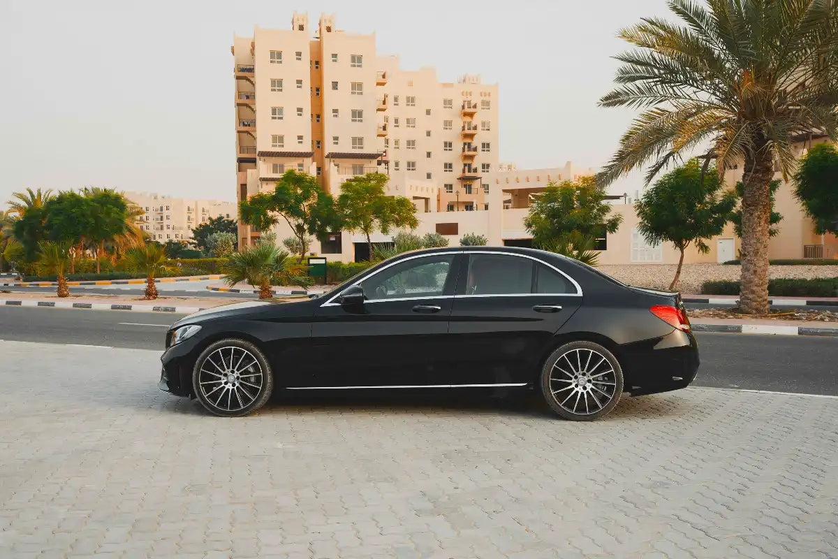 Front grille detail on Mercedes Benz C300, symbolizing prestige in Dubai car rental.